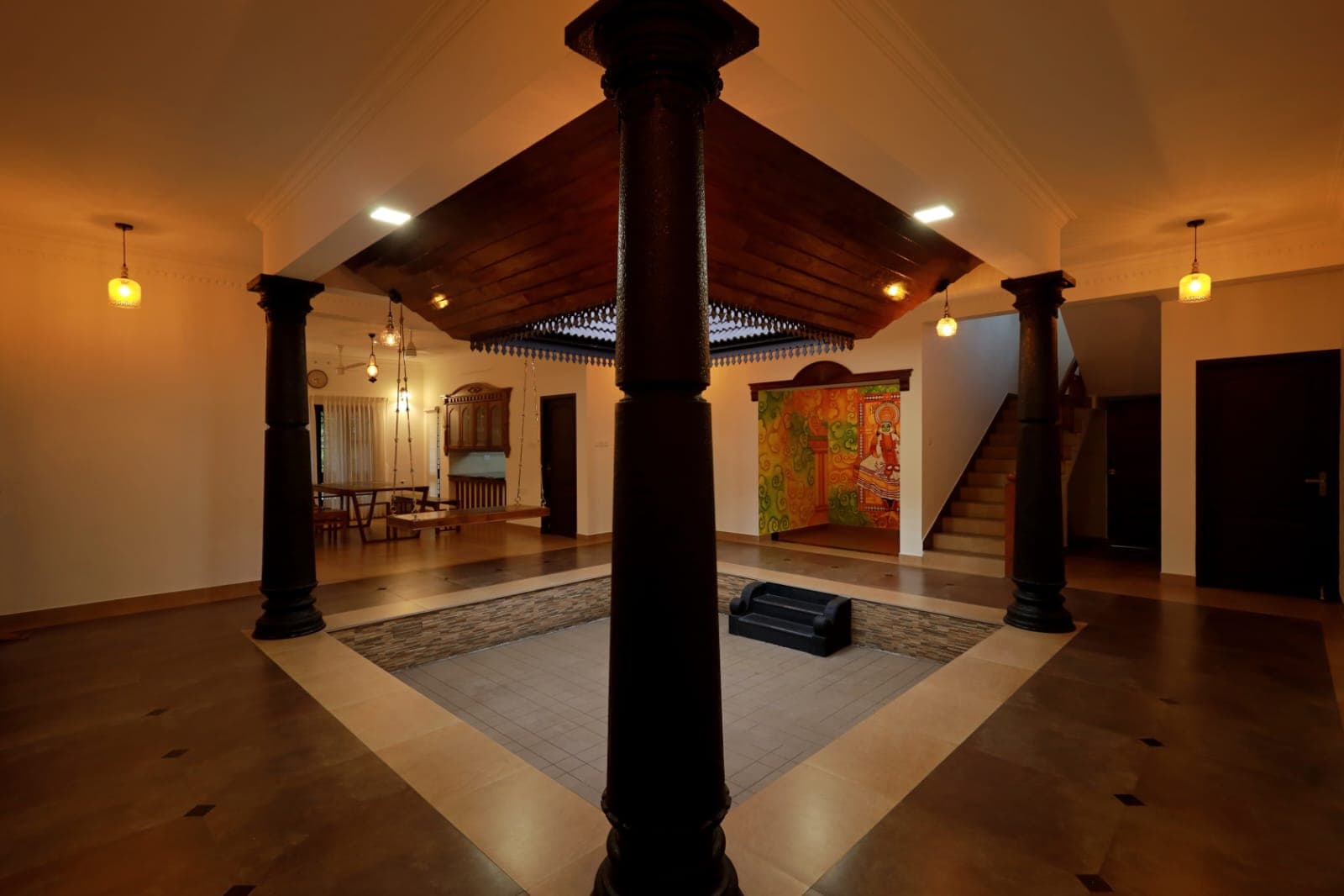 The courtyard with mural and staircase beyond
